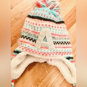 Justice hat. “A” initial. One size. Great shape, my daughter never wore.